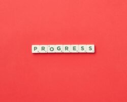 "Progress" text on red background.