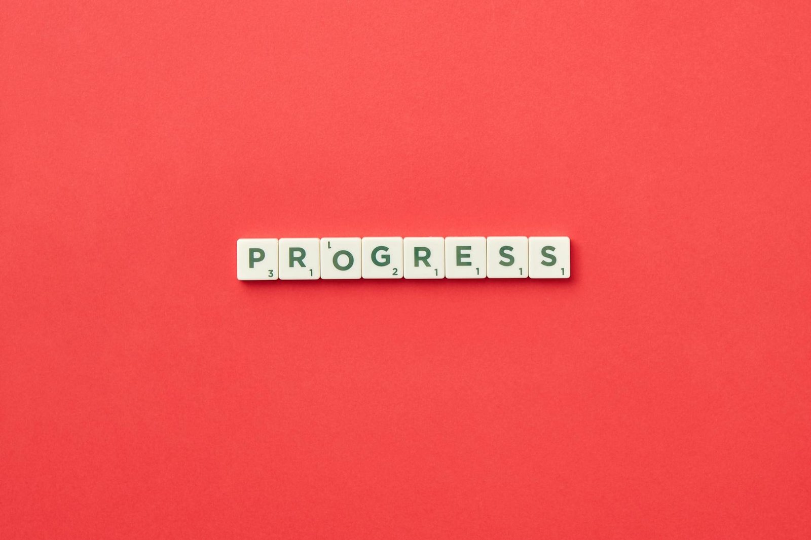 "Progress" text on red background.